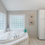 1605 Lawyers Road, Indian Trail, Bullard Realty Group Master Bath with oversized jetted tub and glass block windows