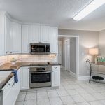 1605 Lawyers Road, Indian Trail, Bullard Realty Group Kitchen with white cabinetry and granite countertops, tile floor