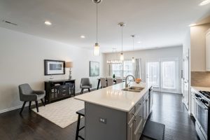1535 S Church has a great layout. Views of the white quartz kitchen with seating area and dining area toward the windows. Bullard Realty Group.