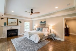 4200 Chelmsford master bedroom retreat on main with gas marble fireplace, double trey ceilings. Bullard Realty Group