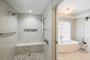 4200 Chelmsford Lane master bath with zero entry shower with dual heads and bench and a frees standing garden tub